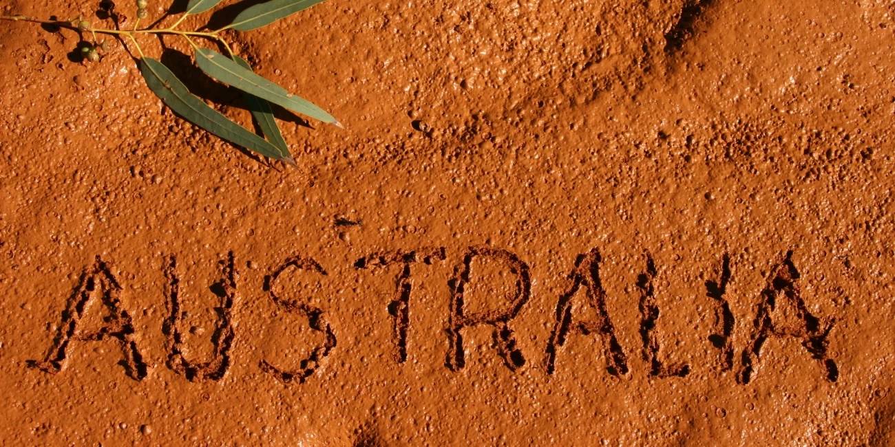 Celebrating NAIDOC Week Outside of NAIDOC Week: This is an image of the word 'Australia' written in the sand.